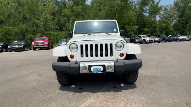 2013 Jeep Wrangler — rear three-quarter view