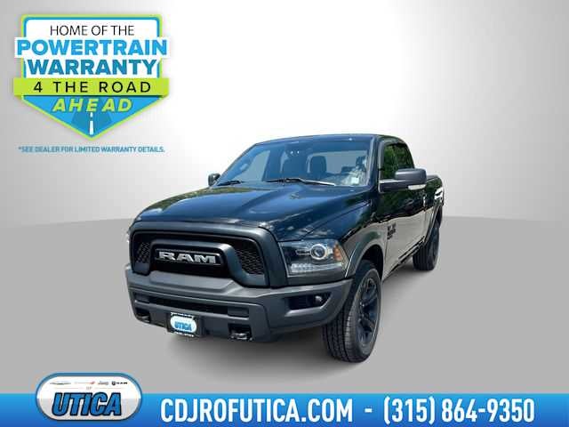 2022 RAM 1500 Classic Warlock Quad Cab 4x4 6'4' Box in Diamond Black Crystal Pearlcoat — front three-quarter view