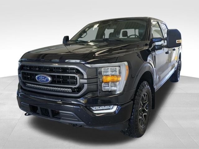 2023 Ford F-150 XLT in Agate Black Metallic — front three-quarter view