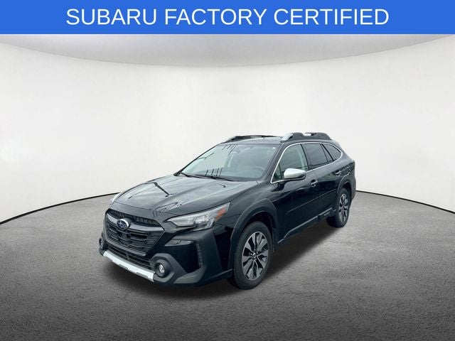 2025 Subaru Outback Touring in Crystal Black Silica — front three-quarter view